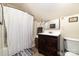 Bathroom featuring a shower with a curtain, a sink, and a toilet at 2451 Reepsville Rd, Lincolnton, NC 28092