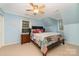 Cozy bedroom with a bed and a nightstand illuminated by natural light at 2451 Reepsville Rd, Lincolnton, NC 28092