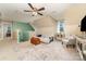 Spacious bonus room featuring a sitting area with a futon, chair, and carpet at 2451 Reepsville Rd, Lincolnton, NC 28092