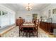 Formal dining room featuring a tray ceiling and hardwood flooring at 2451 Reepsville Rd, Lincolnton, NC 28092