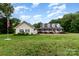 Sprawling home and detached garage with beautiful green lawn and landscaping at 2451 Reepsville Rd, Lincolnton, NC 28092