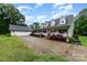 Traditional home boasts a covered front porch, dormer windows and stone driveway at 2451 Reepsville Rd, Lincolnton, NC 28092
