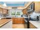 Well-lit kitchen features stainless steel appliances and lots of counter space at 2451 Reepsville Rd, Lincolnton, NC 28092