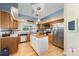 Traditional kitchen features a center island, stainless steel appliances and hardwood flooring at 2451 Reepsville Rd, Lincolnton, NC 28092