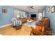 Comfortable living room features hardwood floors, neutral paint and a ceiling fan at 2451 Reepsville Rd, Lincolnton, NC 28092