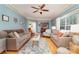 Cozy living room featuring hardwood floors, neutral paint and a ceiling fan at 2451 Reepsville Rd, Lincolnton, NC 28092