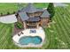 Aerial view showcasing the backyard with pool, lounge area and covered porch at 270 Sandhills Ct, Mooresville, NC 28115