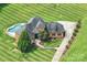 Aerial view of home boasts of a pool, basketball court, and manicured grounds at 270 Sandhills Ct, Mooresville, NC 28115