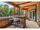 A well-appointed outdoor bar area, perfect for entertaining, with comfortable seating and stylish lighting at 270 Sandhills Ct, Mooresville, NC 28115