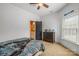 Neutral bedroom features an adjacent bathroom, window and dresser at 270 Sandhills Ct, Mooresville, NC 28115