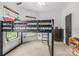 Bright bedroom featuring a black bunk bed and neutral carpet at 270 Sandhills Ct, Mooresville, NC 28115