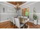 Formal dining room featuring hardwood floors, wood ceiling, and a large window offering natural light at 270 Sandhills Ct, Mooresville, NC 28115