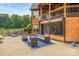 A view of the home's exterior featuring a private patio and seating area with access to the house at 270 Sandhills Ct, Mooresville, NC 28115