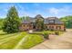 Charming home with manicured lawn, stone accents, and a welcoming walkway at 270 Sandhills Ct, Mooresville, NC 28115