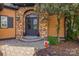 Charming front entry with a stone archway, double doors, and landscaped surroundings at 270 Sandhills Ct, Mooresville, NC 28115