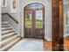 Elegant front entry with beautiful doors, hardwood floors, and staircase at 270 Sandhills Ct, Mooresville, NC 28115