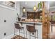 Kitchen bar area with granite countertops, pendant lighting and counter seating at 270 Sandhills Ct, Mooresville, NC 28115