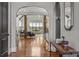 Inviting living room featuring wood floors, beams, open floor plan, and abundant natural light at 270 Sandhills Ct, Mooresville, NC 28115