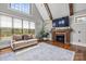 Bright living room with vaulted ceilings, hardwood floors, and a cozy fireplace at 270 Sandhills Ct, Mooresville, NC 28115