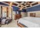 Main bedroom features a coffered ceiling, a large TV, and a private entrance to a porch at 270 Sandhills Ct, Mooresville, NC 28115