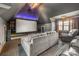 Home theater room complete with plush seating, large screen and dark walls at 270 Sandhills Ct, Mooresville, NC 28115