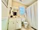 Cozy bathroom with white cabinets, a shower-tub combo, and neutral tile, offering a clean and functional space at 2810 Elizabeth Ave, Shelby, NC 28150