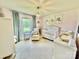Bedroom features a white crib, plush chair, soft chandelier and ample natural light at 2810 Elizabeth Ave, Shelby, NC 28150