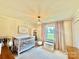 Bright Bedroom with a crib, dresser, window, and charming decor, creating a warm and inviting atmosphere at 2810 Elizabeth Ave, Shelby, NC 28150