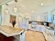Clean kitchen featuring white cabinets, tile backsplash, and a view of the dining area at 2810 Elizabeth Ave, Shelby, NC 28150