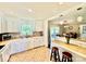 Charming kitchen with white cabinetry, tile countertops, and a view into the dining area at 2810 Elizabeth Ave, Shelby, NC 28150
