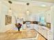 Bright kitchen with white cabinets, tile countertops, and a view into the living spaces at 2810 Elizabeth Ave, Shelby, NC 28150
