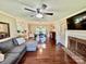 Bright and airy living room with hardwood floors, a fireplace, and seamless flow into the dining area at 2810 Elizabeth Ave, Shelby, NC 28150