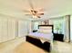 Spacious main bedroom with a ceiling fan, neutral carpet, and ample closet space, creating a comfortable and inviting retreat at 2810 Elizabeth Ave, Shelby, NC 28150