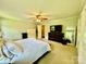 Spacious main bedroom with neutral carpet, ceiling fan, and ample closet space at 2810 Elizabeth Ave, Shelby, NC 28150