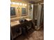 Bathroom with double vanity sinks, shower, and tile flooring at 29386 Nelson Mountain Rd, Albemarle, NC 28001