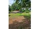Exterior view of a sunroom and surrounding wooded property at 29386 Nelson Mountain Rd, Albemarle, NC 28001