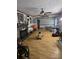 Cozy living room features a fireplace, ceiling fan, and hardwood style floors at 29386 Nelson Mountain Rd, Albemarle, NC 28001