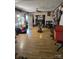 Large living room featuring multiple windows, ceiling fans, and hard surface flooring at 29386 Nelson Mountain Rd, Albemarle, NC 28001