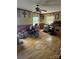 Living room with hardwood floors, ceiling fan, and natural light at 29386 Nelson Mountain Rd, Albemarle, NC 28001