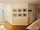 Entryway of home showing hardwood flooring and gallery wall at 312 Shady Ln, Lincolnton, NC 28092