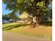 A charming home with a covered porch and a large tree in the front yard at 312 Shady Ln, Lincolnton, NC 28092