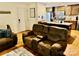 Open concept living room and kitchen with dark wood cabinets and stainless appliances at 312 Shady Ln, Lincolnton, NC 28092