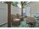 Relaxing backyard patio with comfortable seating, a wooden table, and a privacy fence at 327 Wilkes Place Dr, Fort Mill, SC 29715