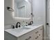 This bathroom features double sinks, white cabinets and marble countertops at 327 Wilkes Place Dr, Fort Mill, SC 29715