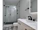 Modern bathroom featuring glass shower with hexagon tiles, and white marble sink at 327 Wilkes Place Dr, Fort Mill, SC 29715