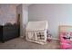 Cozy bedroom featuring a tent, soft carpet, and a playfully decorated accent wall at 327 Wilkes Place Dr, Fort Mill, SC 29715