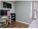Bright bedroom featuring a desk, shelving, wood floors, and great natural light at 327 Wilkes Place Dr, Fort Mill, SC 29715