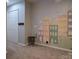 Playful room with a colorful mural, closet and carpet, creating a fun and inviting space for children at 327 Wilkes Place Dr, Fort Mill, SC 29715