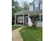 Charming home featuring a cozy front porch, brick accents, and well-maintained landscaping at 327 Wilkes Place Dr, Fort Mill, SC 29715