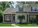 Inviting two-story home with a brick facade, neutral siding, and manicured front lawn at 327 Wilkes Place Dr, Fort Mill, SC 29715